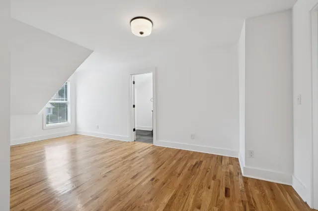 an aerial view of residential houses with outdoor space and street view