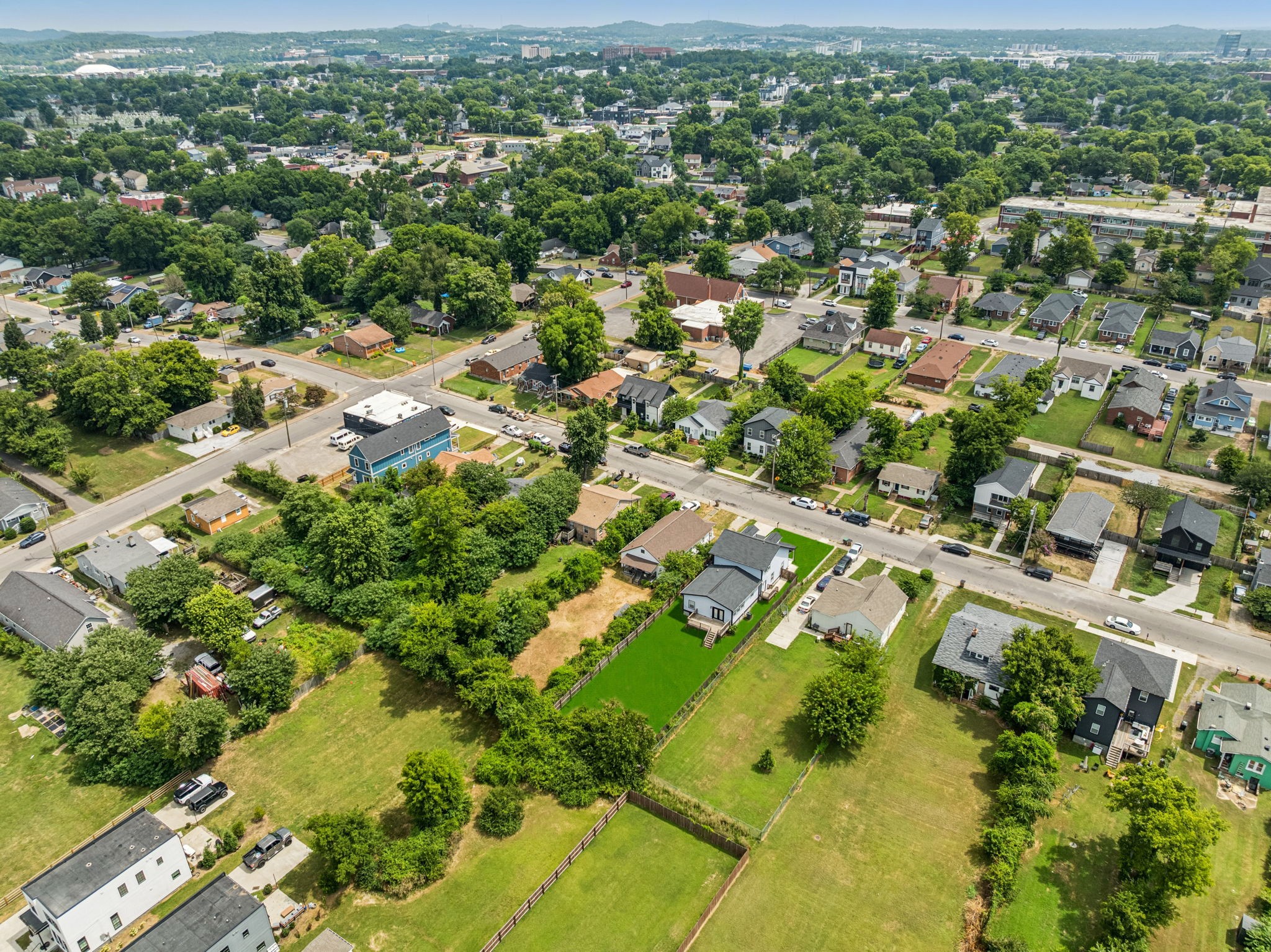 1613 23rd Avenue North Nashville, TN 37208 - Photo 57 of 58 an aerial view of residential houses with outdoor space and trees
