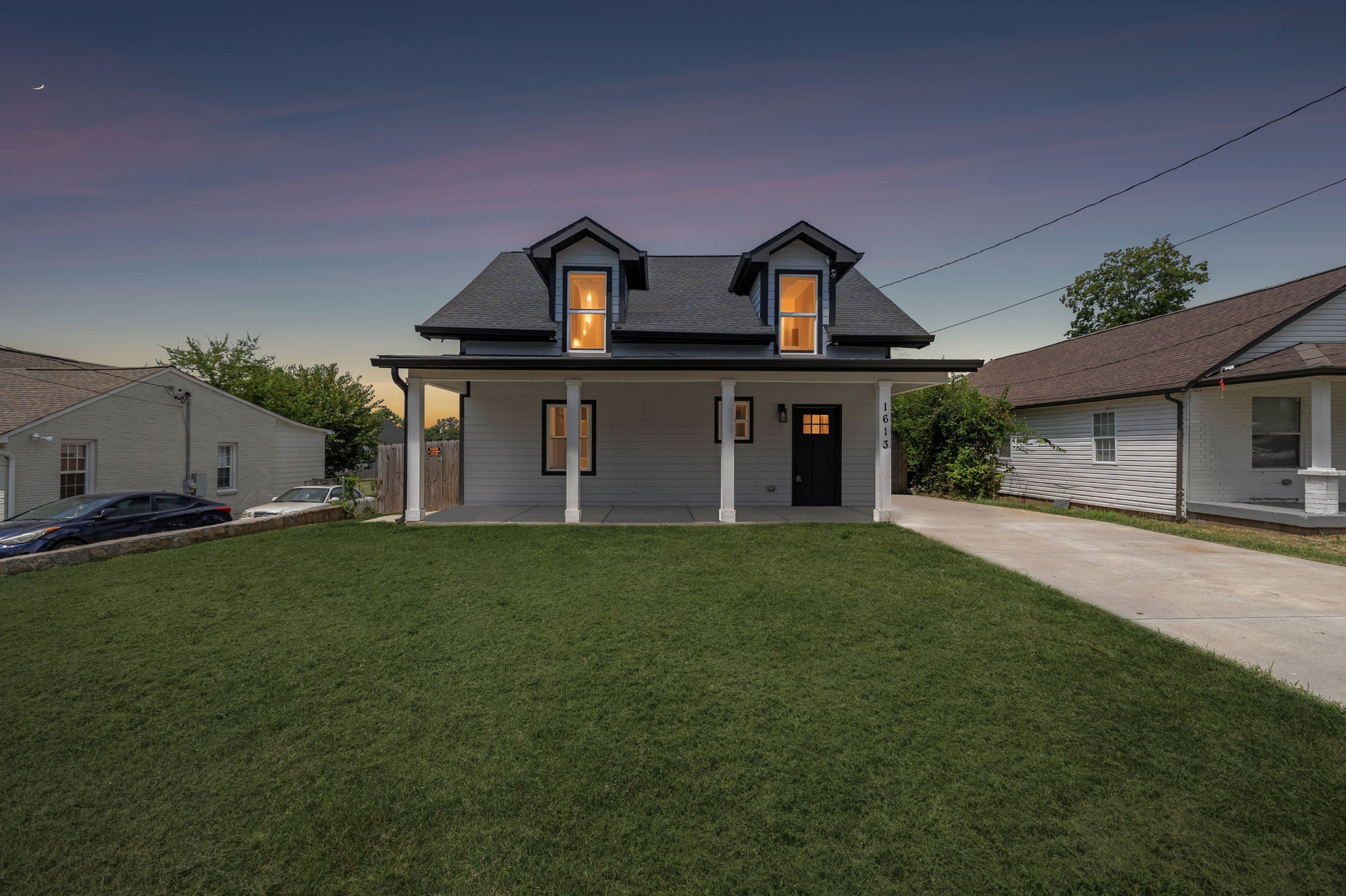 1613 23rd Avenue North Nashville, TN 37208 - Photo 58 of 58 a front view of a house with a garden and yard