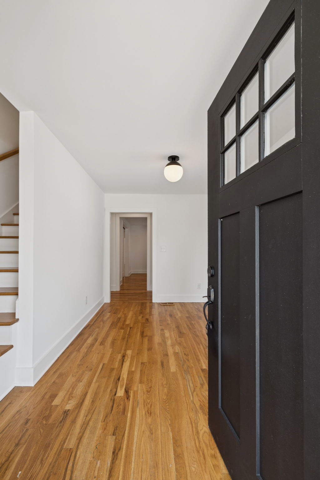 1613 23rd Avenue North Nashville, TN 37208 - Photo 6 of 58 a view of empty room with wooden floor and fan