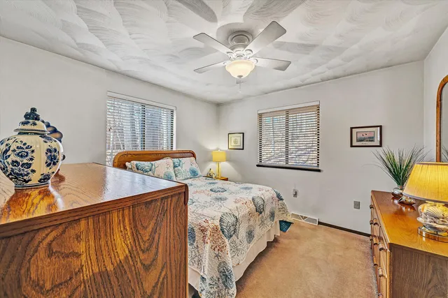 a bedroom with double bed and a window