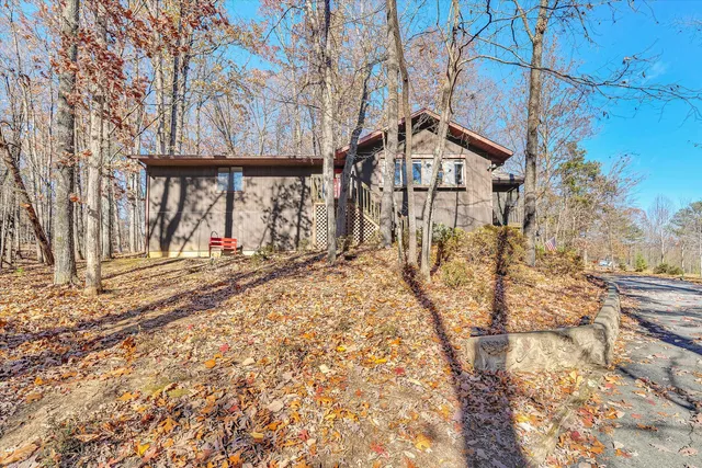 a view of a house with snow on the background