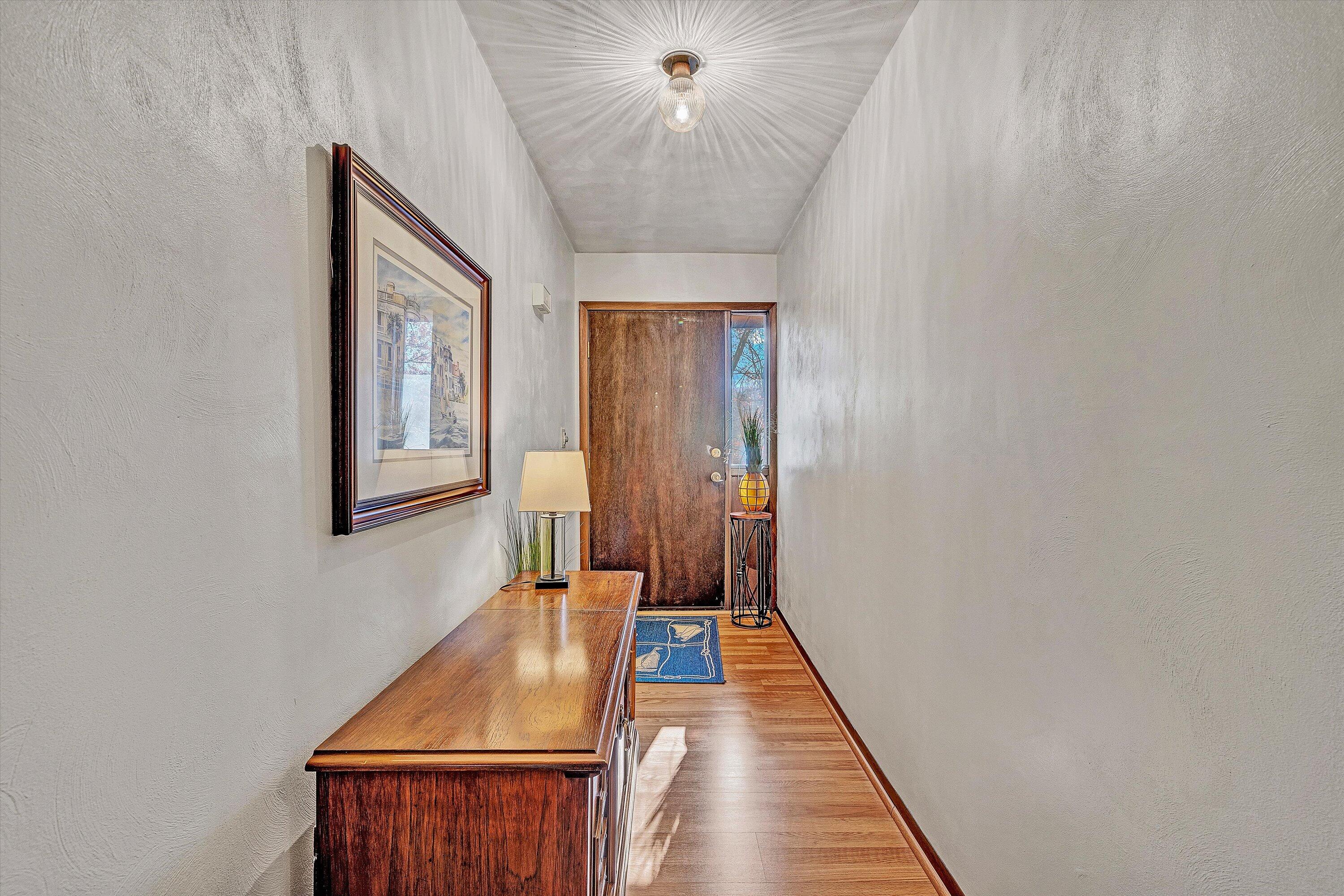 1046 Mountain Pass Road Blue Ridge, VA 24064 - Photo 4 of 25 a view of a hallway with a window and a chandelier