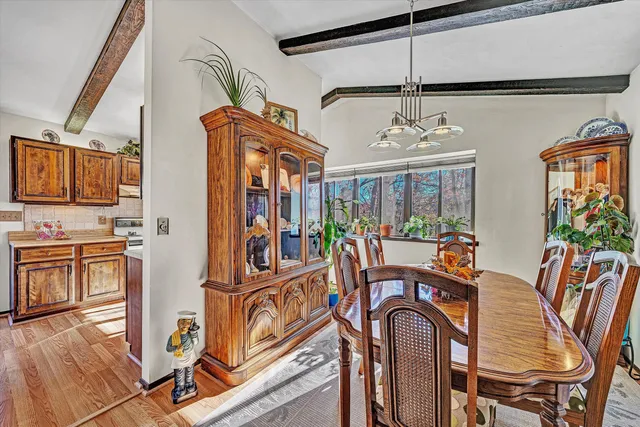 a view of a dining room with furniture window and outside view