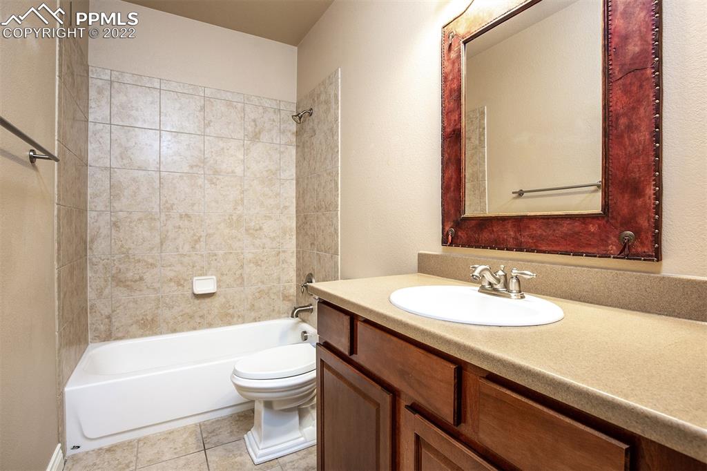 2361 Conservatory Point Colorado Springs, CO 80918 - Photo 14 of 50 a bathroom with a sink a toilet and shower
