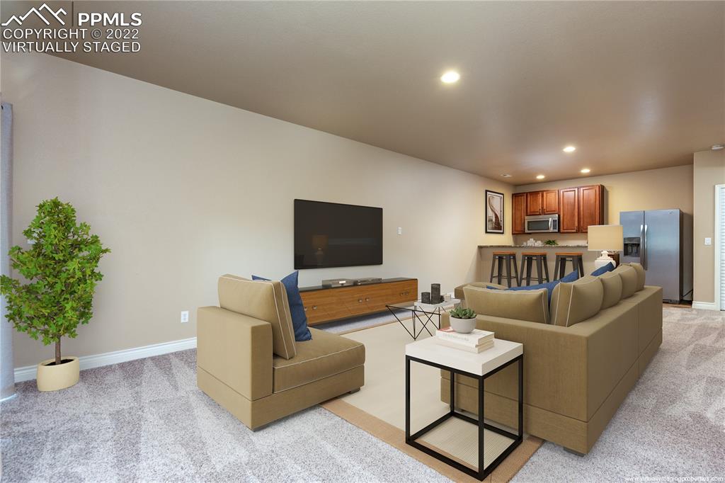 2361 Conservatory Point Colorado Springs, CO 80918 - Photo 20 of 50 a living room with furniture and flowers