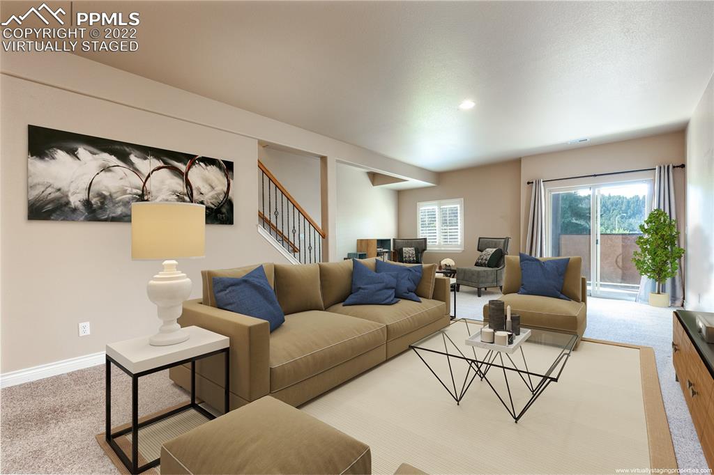 2361 Conservatory Point Colorado Springs, CO 80918 - Photo 22 of 50 a living room with furniture and a large window