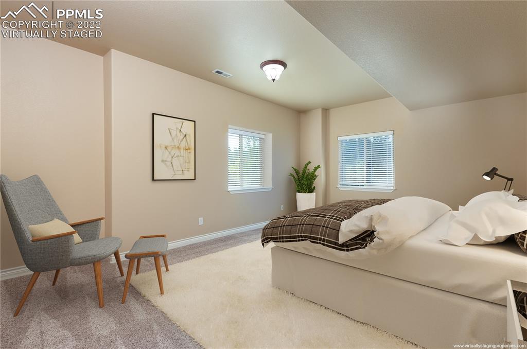 2361 Conservatory Point Colorado Springs, CO 80918 - Photo 28 of 50 a living room with furniture and a window