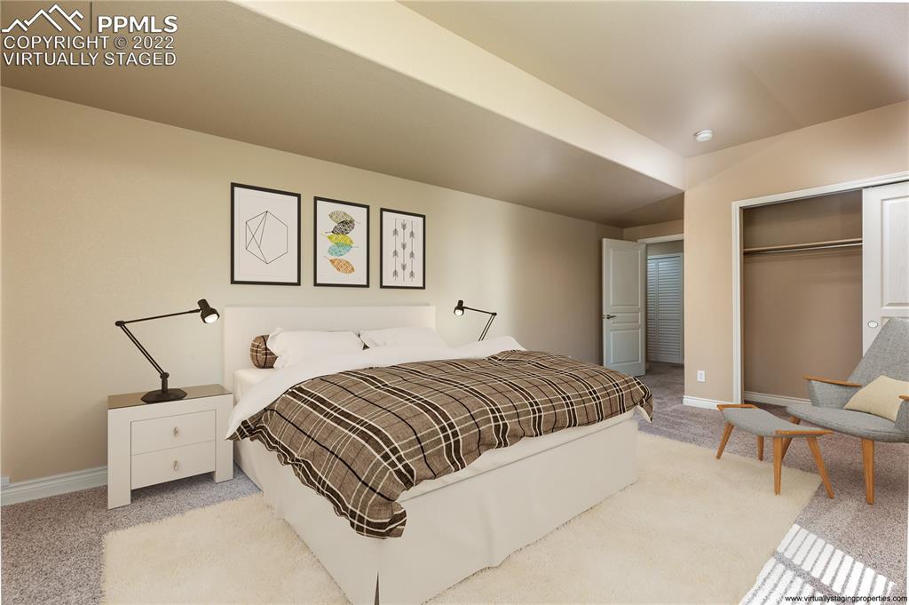 2361 Conservatory Point Colorado Springs, CO 80918 - Photo 29 of 50 a bedroom with a bed and a cabinets