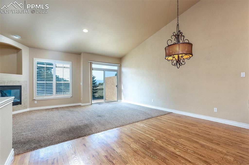 2361 Conservatory Point Colorado Springs, CO 80918 - Photo 30 of 50 an empty room with wooden floor and windows