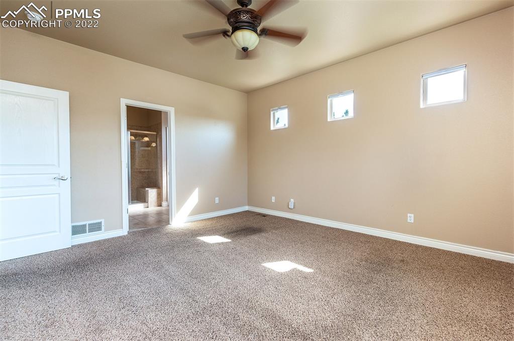 2361 Conservatory Point Colorado Springs, CO 80918 - Photo 37 of 50 a view of a livingroom with a ceiling fan and window