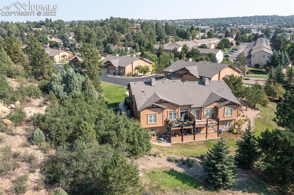 2361 Conservatory Point Colorado Springs, CO 80918 - Photo 4 of 50 an aerial view of a house with a garden and lake view