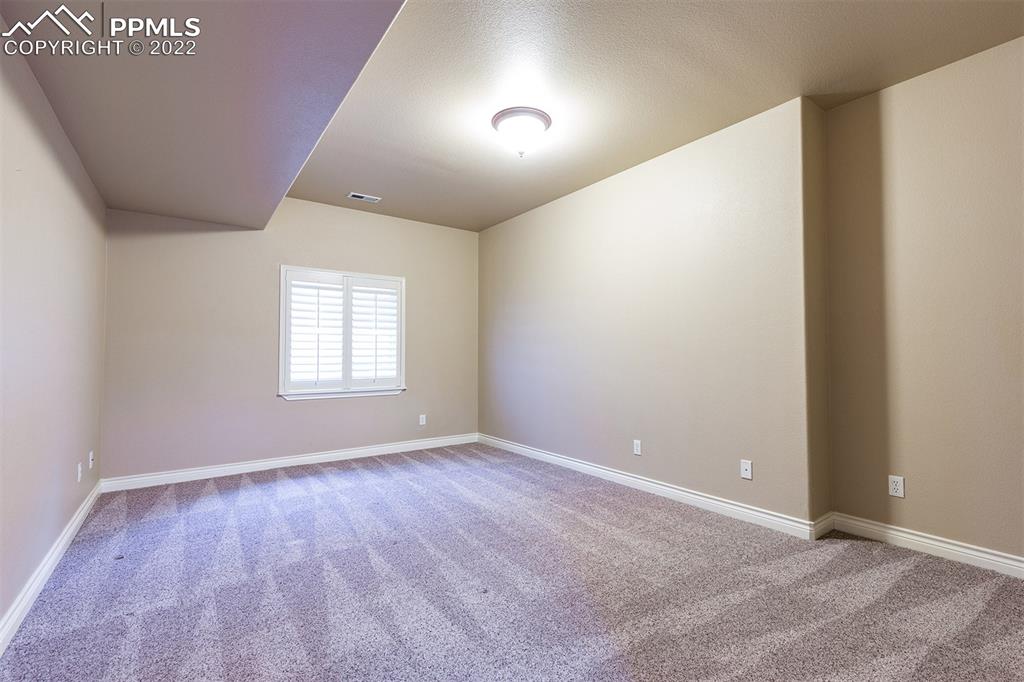 2361 Conservatory Point Colorado Springs, CO 80918 - Photo 46 of 50 a view of an empty room with wooden floor and a window