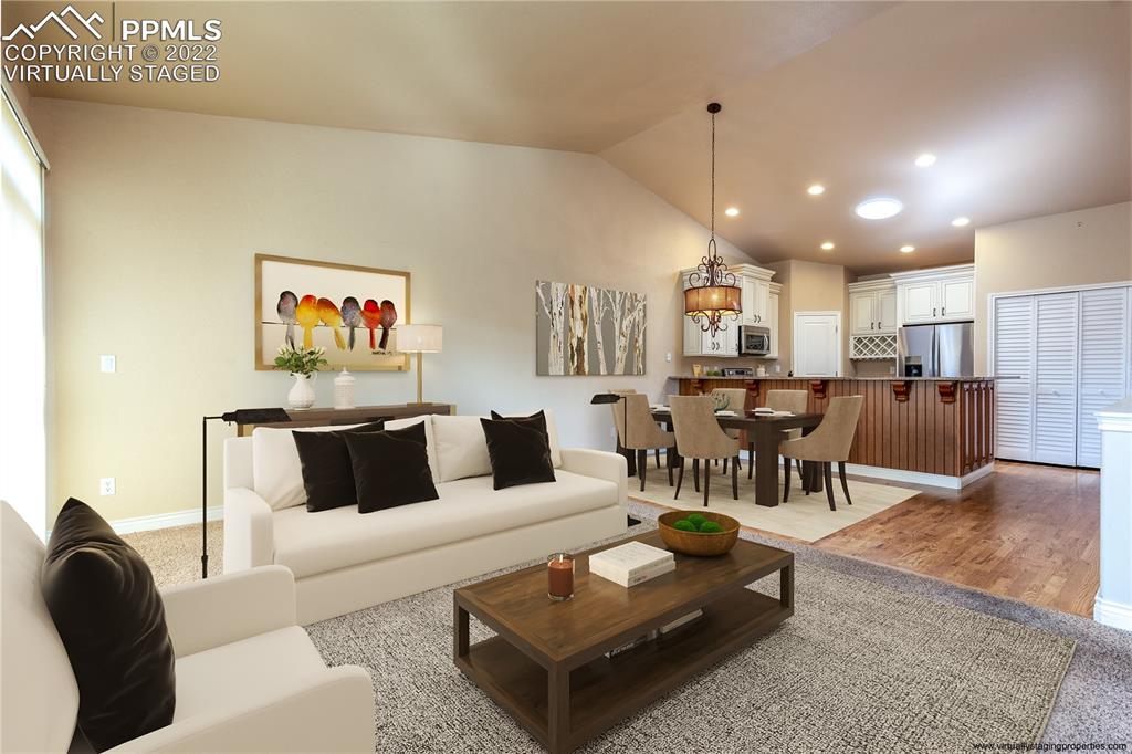 2361 Conservatory Point Colorado Springs, CO 80918 - Photo 8 of 50 a living room with furniture and kitchen view