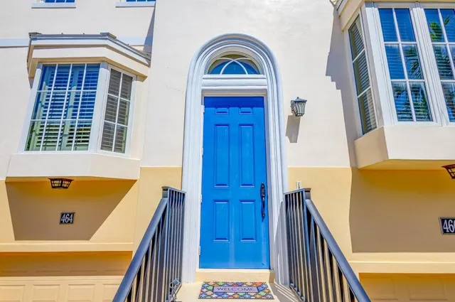 a view of residential house with wooden door