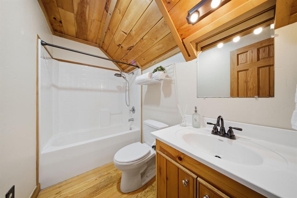 465 Emberson Ranch Road Pilot Point, TX 76258 - Photo 23 of 40 a bathroom with a sink a toilet and shower