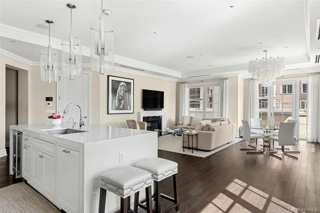 a living room with fireplace furniture and a wooden floor