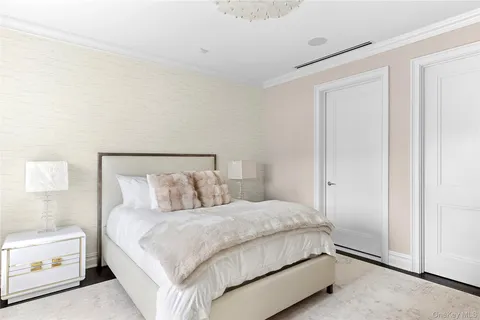 a bedroom with a bed and a lamp