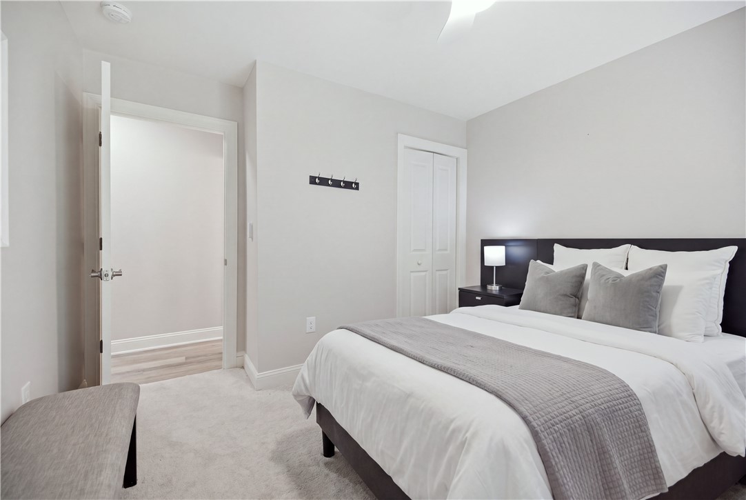 106 Jarrett Road Anderson, SC 29626 - Photo 21 of 29 Guest bedroom on the Lower Level with Sliding Glass Door access to Covered Patio and Wood Burning Fireplace
