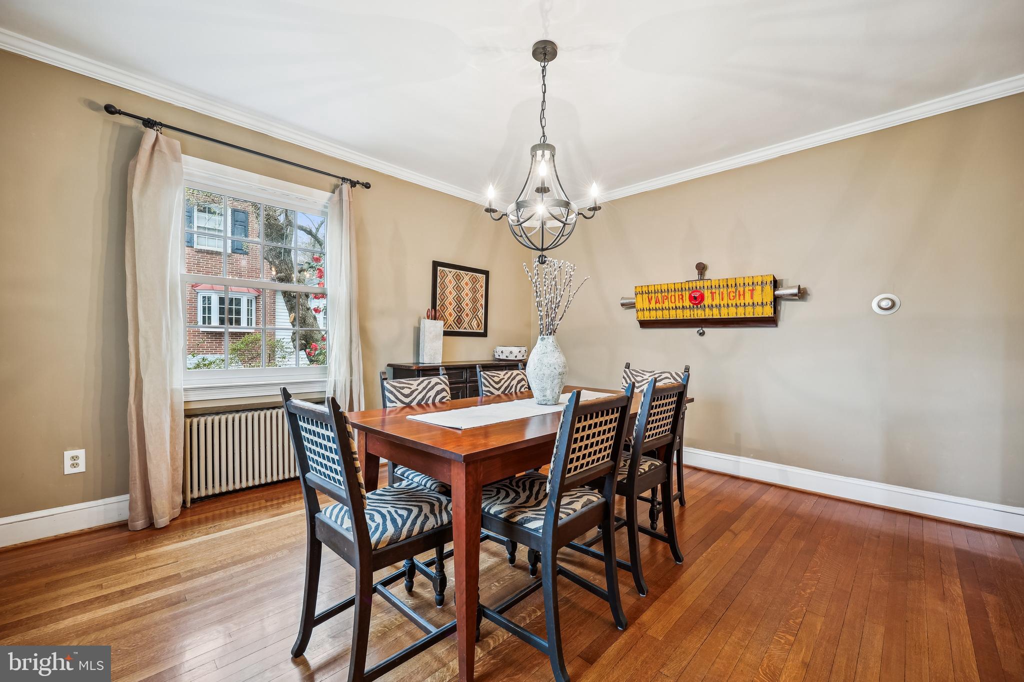 9014 Fairview Road Silver Spring, MD 20910 - Photo 12 of 94 a view of a dining room with furniture a chandelier and wooden floor