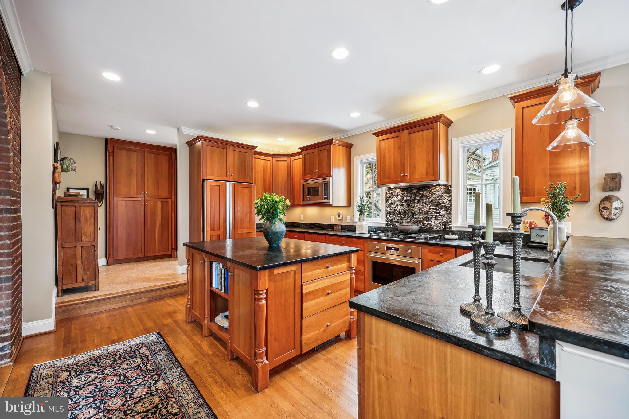 9014 Fairview Road Silver Spring, MD 20910 - Photo 17 of 94 a kitchen with stainless steel appliances granite countertop sink stove and refrigerator