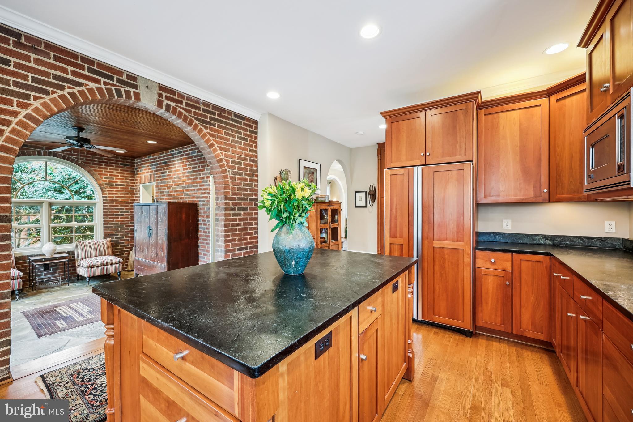 9014 Fairview Road Silver Spring, MD 20910 - Photo 23 of 94 a kitchen with stainless steel appliances granite countertop a sink a refrigerator and a stove