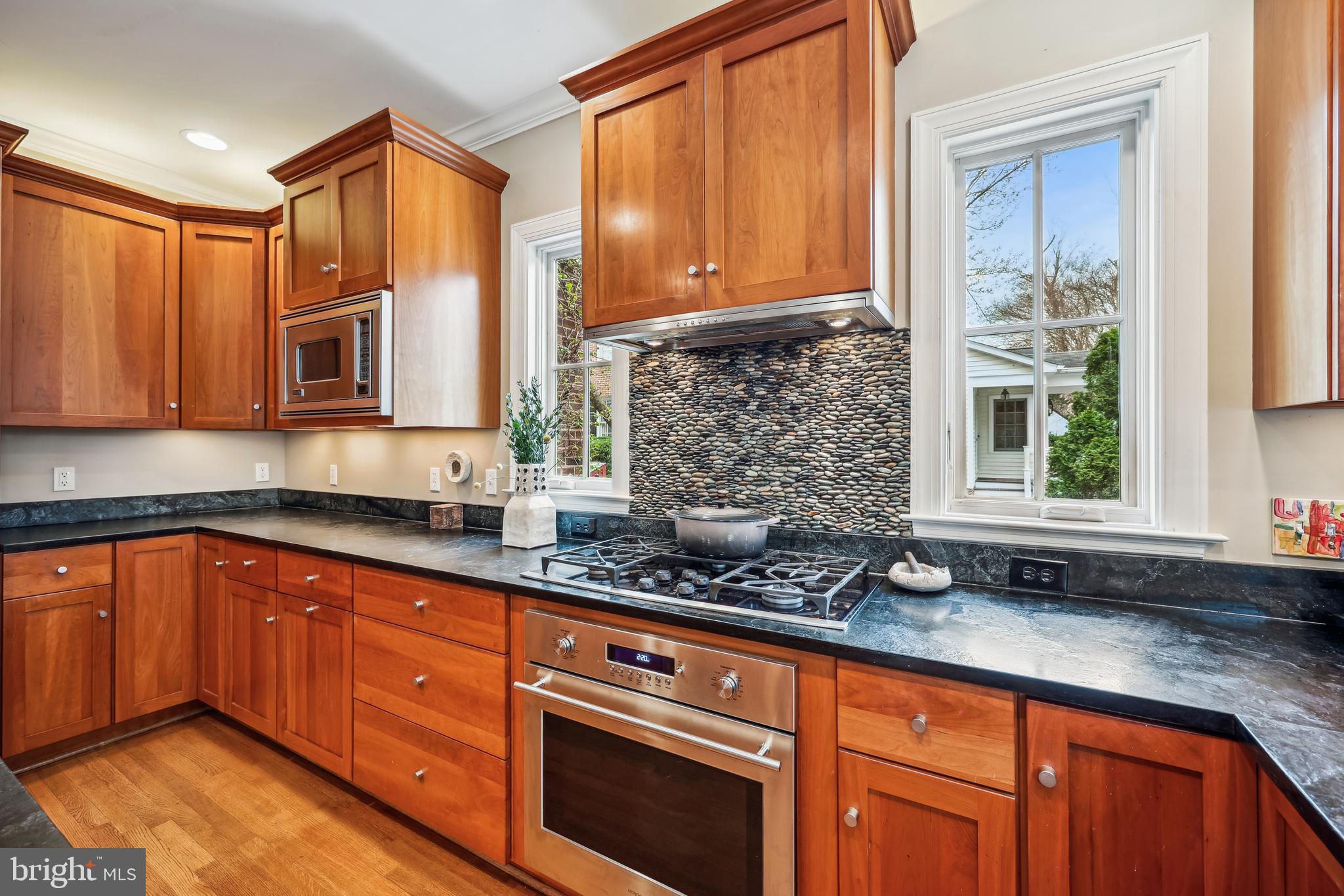 9014 Fairview Road Silver Spring, MD 20910 - Photo 24 of 94 a kitchen with stainless steel appliances granite countertop a sink stove and cabinets