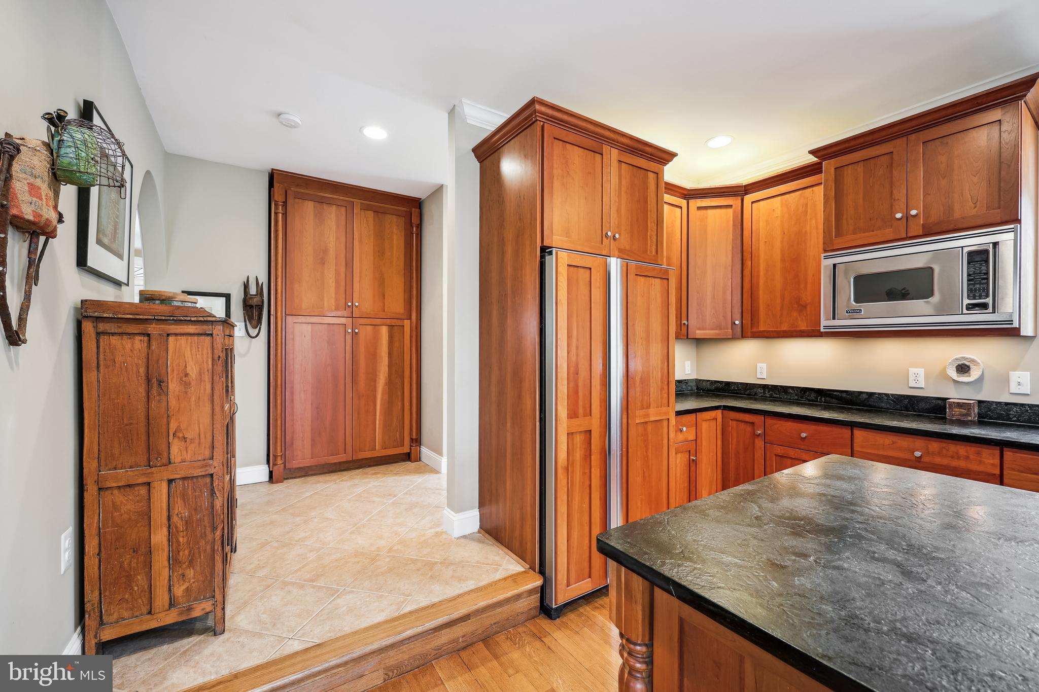 9014 Fairview Road Silver Spring, MD 20910 - Photo 25 of 94 a kitchen with stainless steel appliances granite countertop a refrigerator and a sink