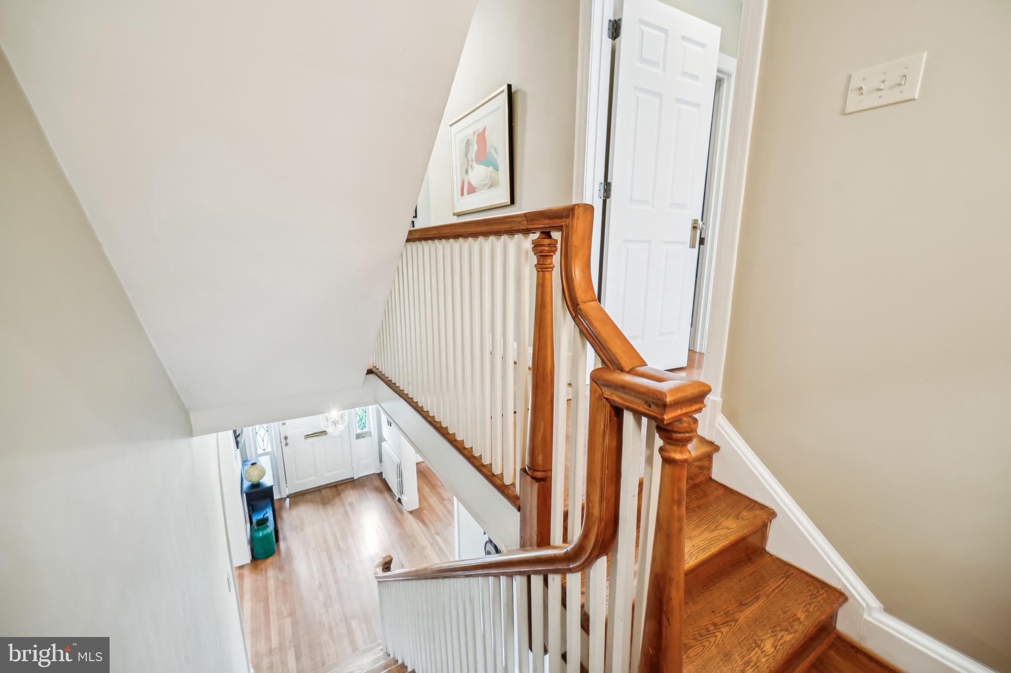9014 Fairview Road Silver Spring, MD 20910 - Photo 30 of 94 a view of staircase with wooden floor and white walls