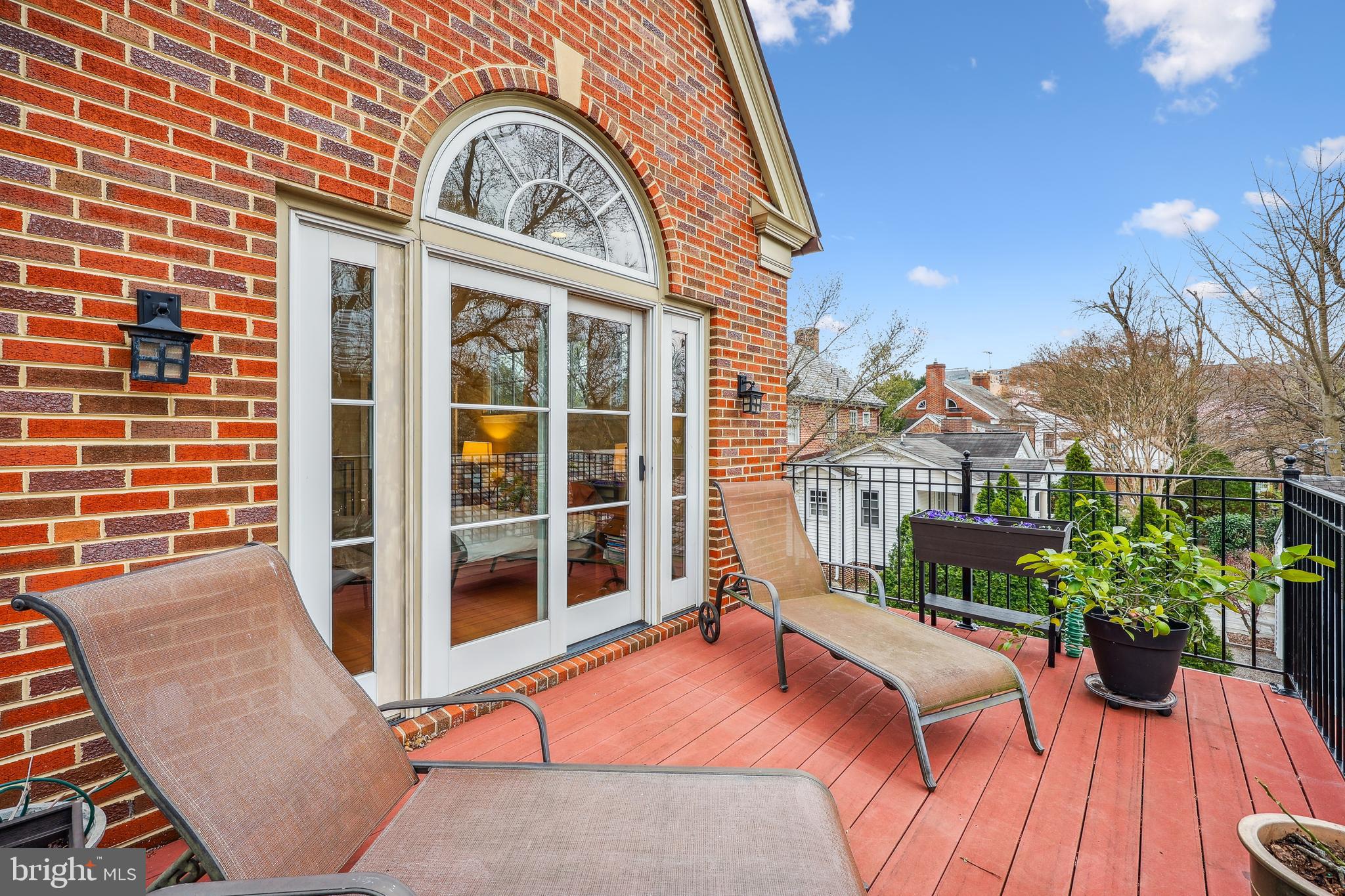 9014 Fairview Road Silver Spring, MD 20910 - Photo 34 of 94 a view of a house with a large window and flower plants