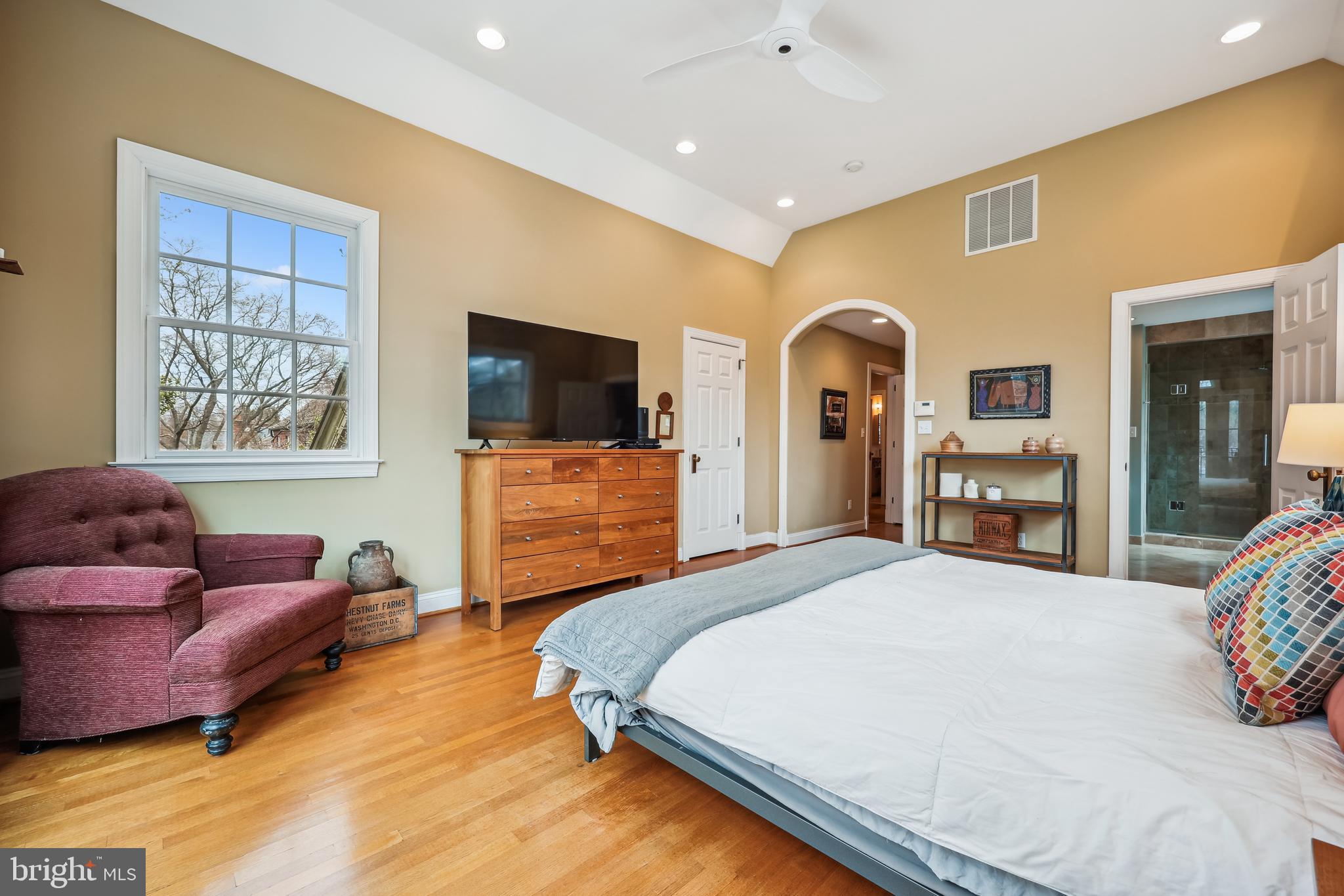9014 Fairview Road Silver Spring, MD 20910 - Photo 35 of 94 a spacious bedroom with a bed and a flat screen television