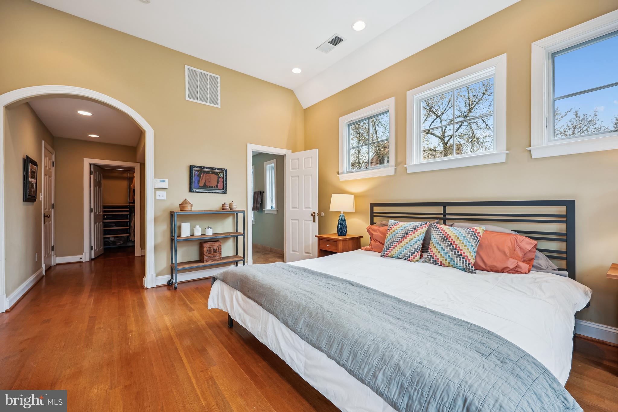 9014 Fairview Road Silver Spring, MD 20910 - Photo 36 of 94 a bedroom with a large bed and a chandelier