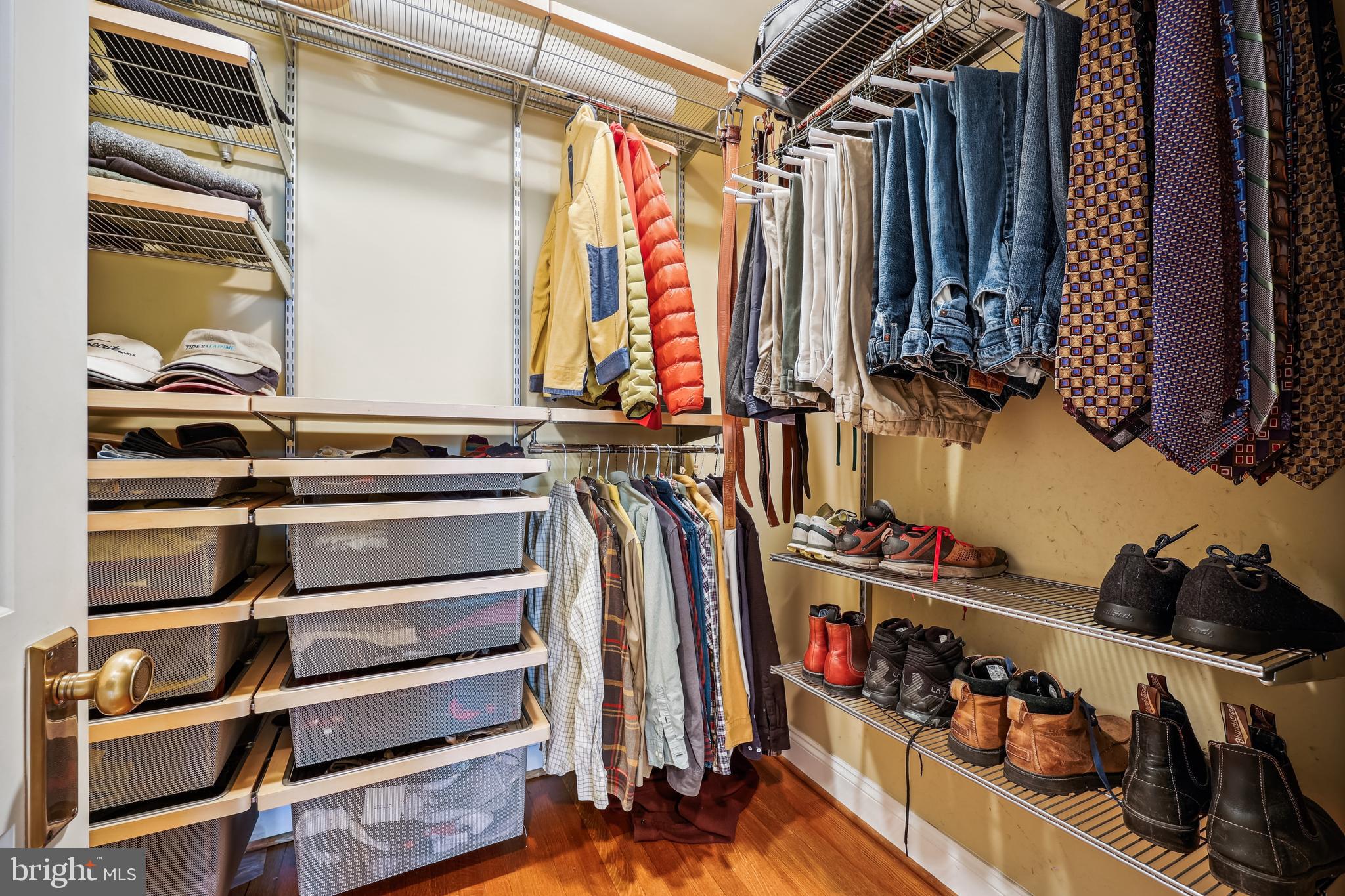 9014 Fairview Road Silver Spring, MD 20910 - Photo 39 of 94 a view of walk in closet with clothes and shoes