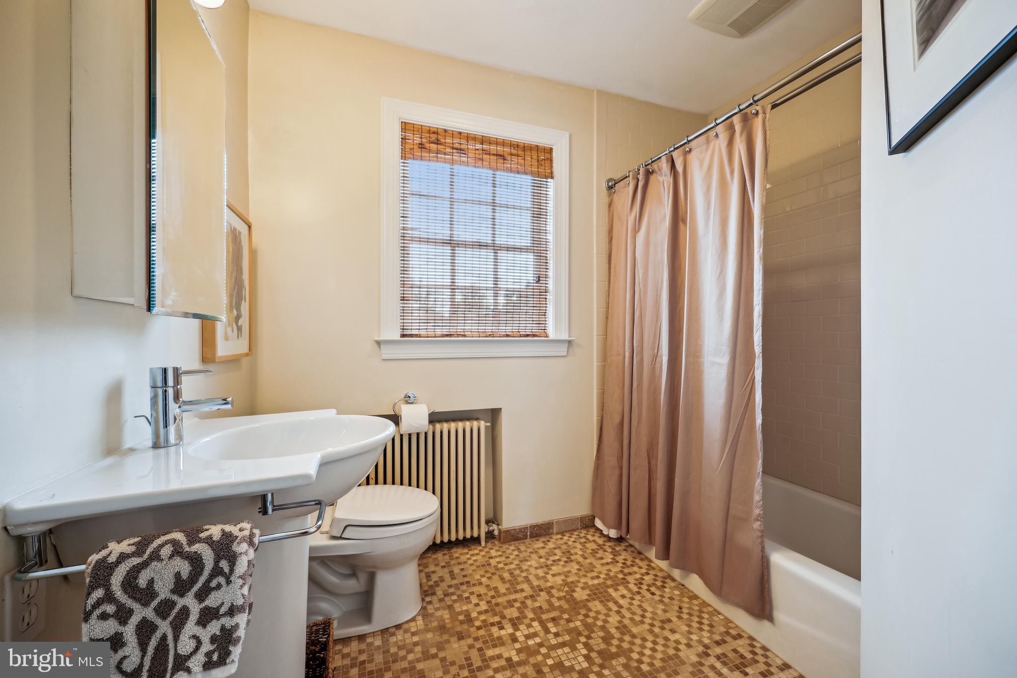 9014 Fairview Road Silver Spring, MD 20910 - Photo 45 of 94 a bathroom with a sink toilet and shower