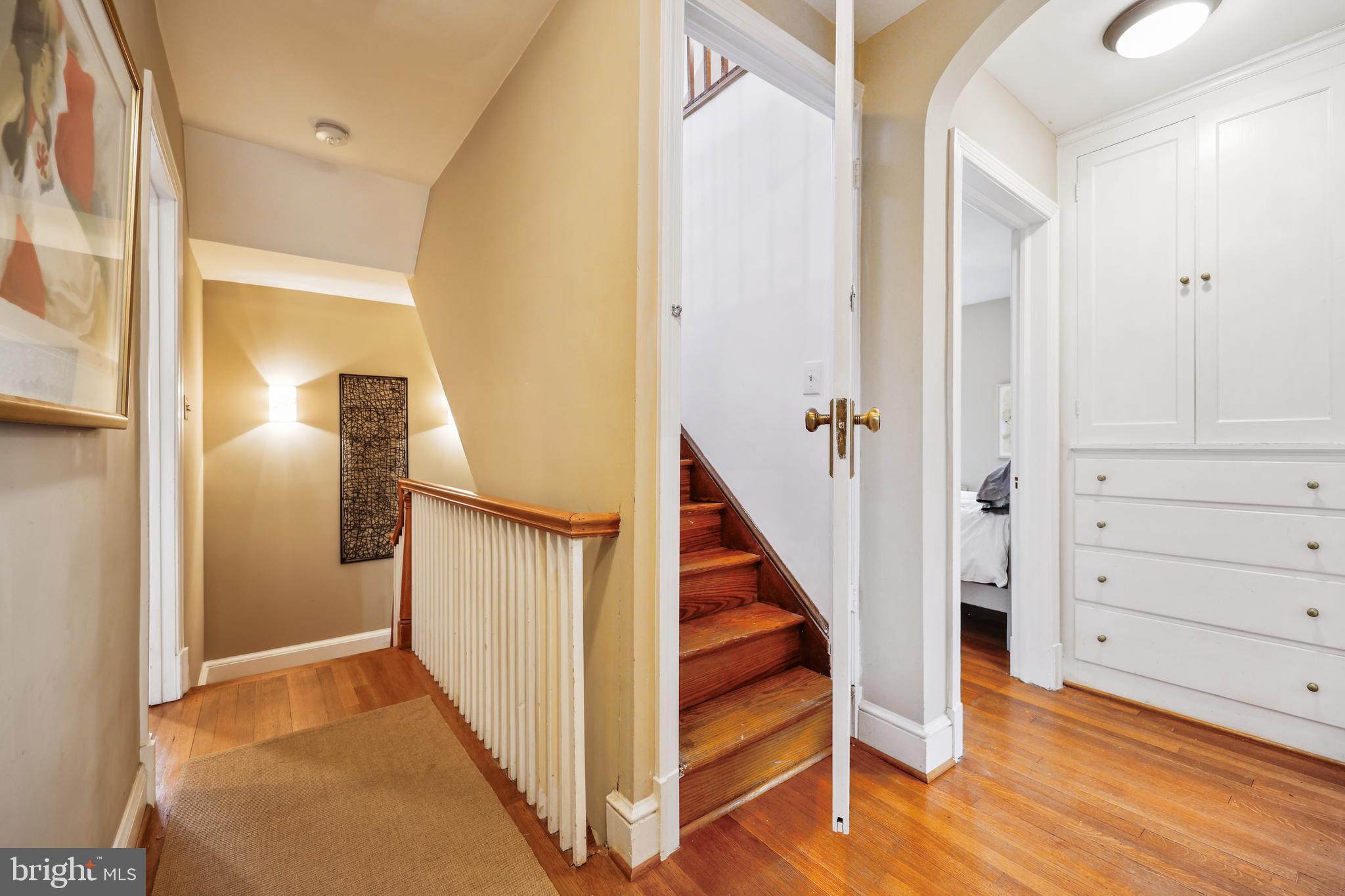 9014 Fairview Road Silver Spring, MD 20910 - Photo 52 of 94 a view of a hallway with wooden floor and entryway