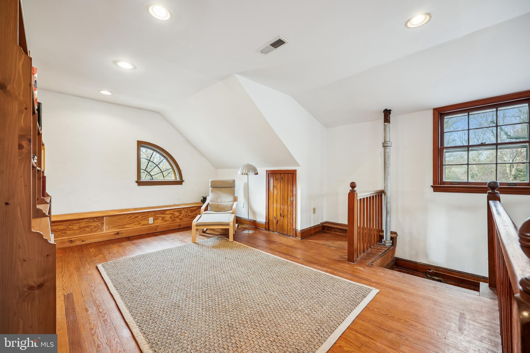 9014 Fairview Road Silver Spring, MD 20910 - Photo 54 of 94 a living room with furniture gym equipment and a large window