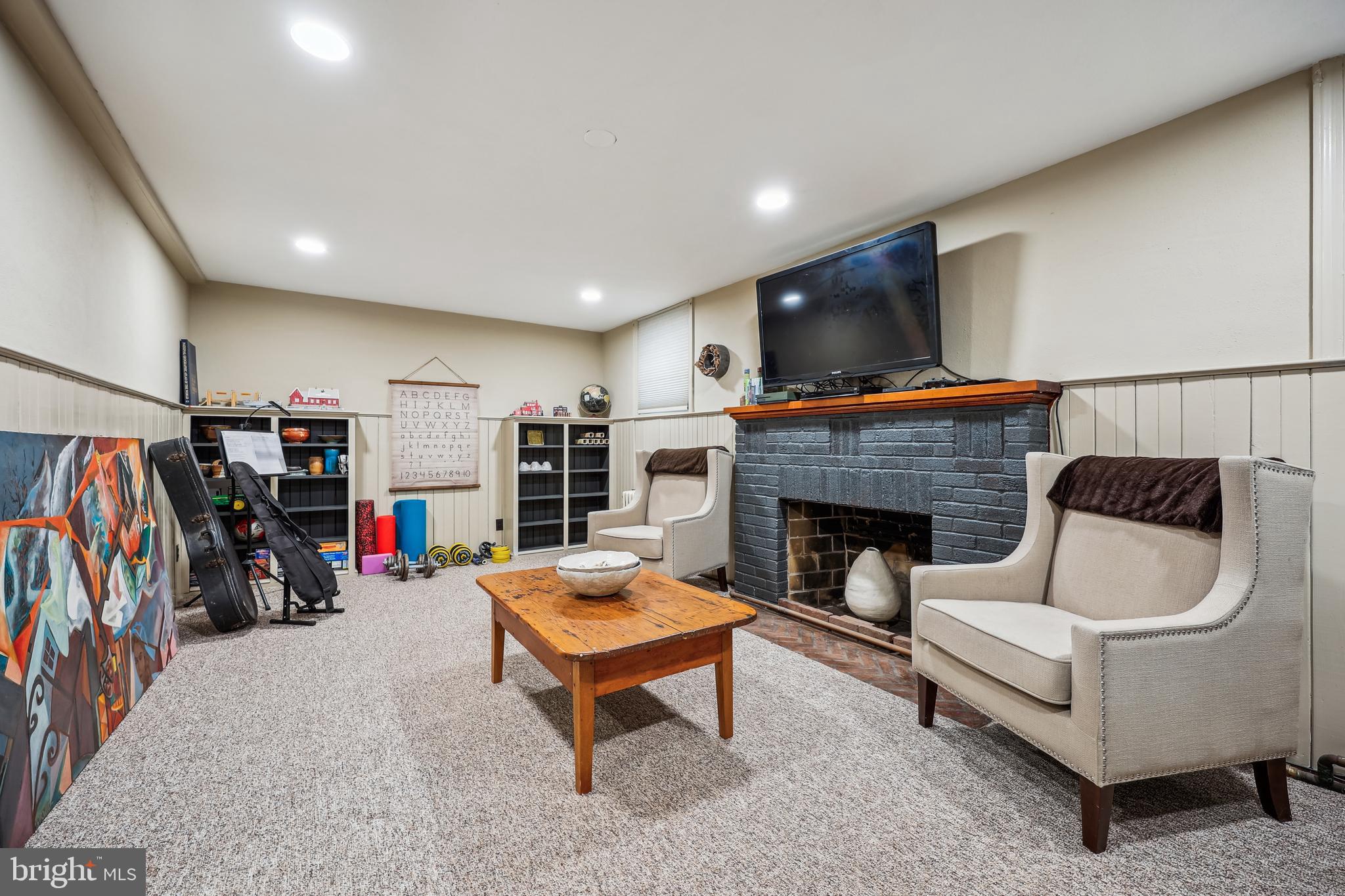9014 Fairview Road Silver Spring, MD 20910 - Photo 61 of 94 a living room with furniture and a fireplace
