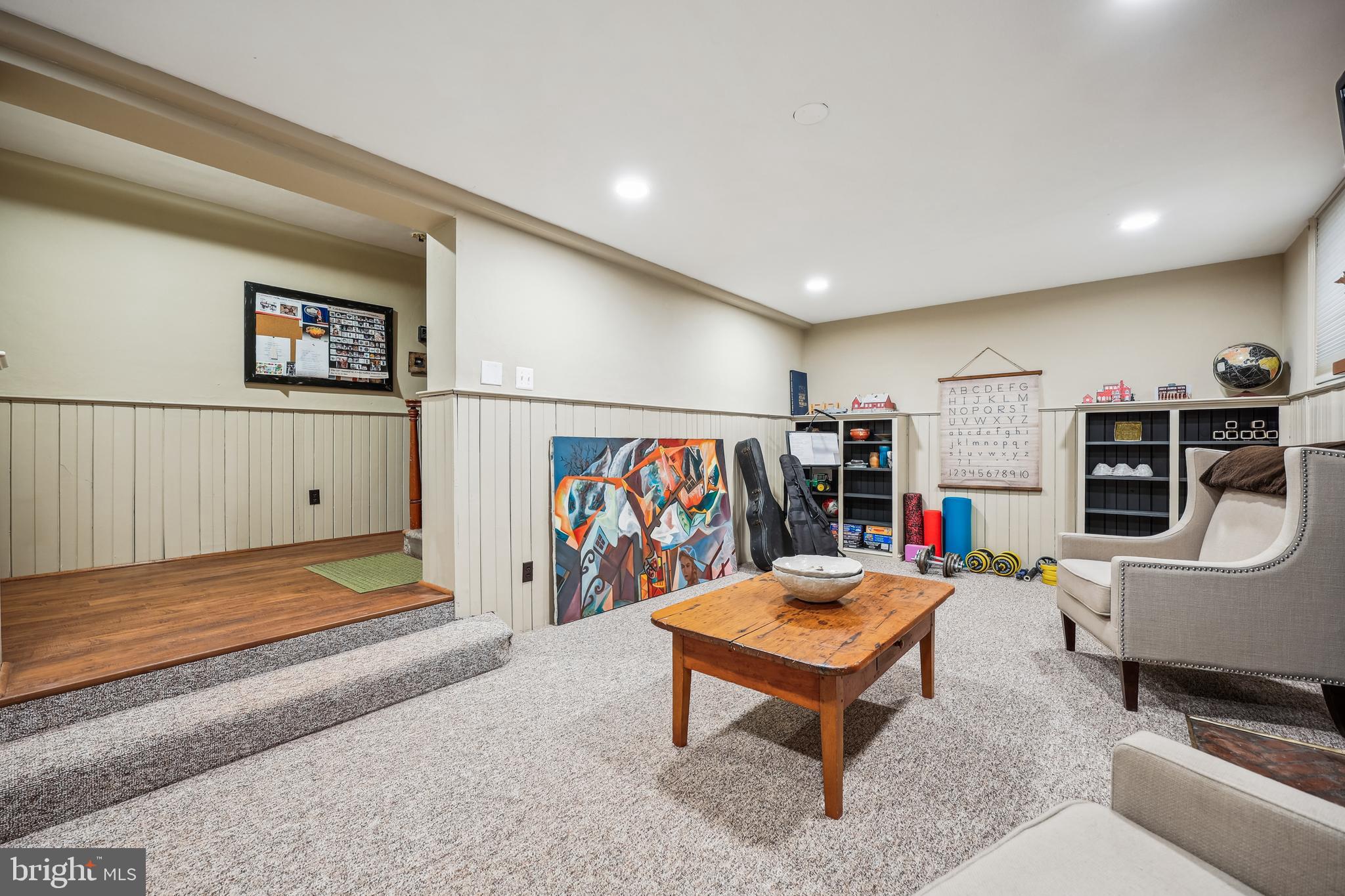 9014 Fairview Road Silver Spring, MD 20910 - Photo 64 of 94 a living room with furniture gym equipment and a rug