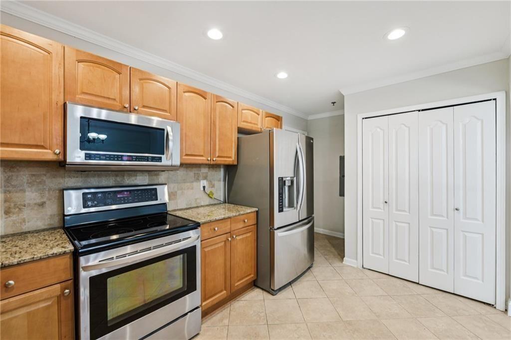 2825 Northeast Expressway, Unit F3 Atlanta, GA 30345 - Photo 18 of 45 a kitchen with a refrigerator stove and microwave