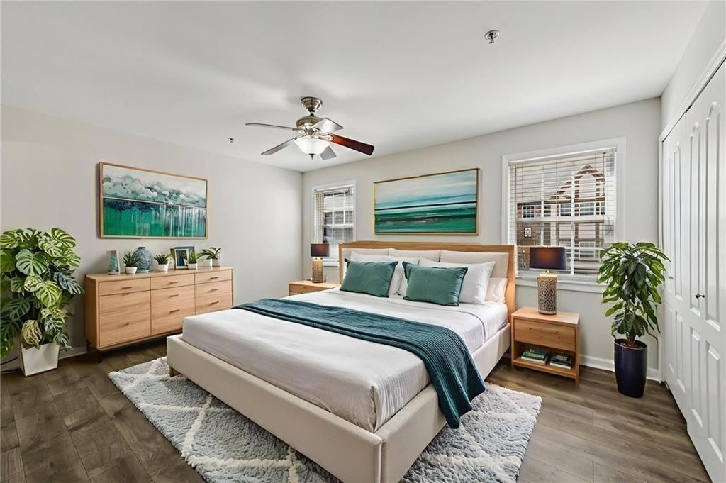 2825 Northeast Expressway, Unit F3 Atlanta, GA 30345 - Photo 22 of 45 a bedroom with a large bed and a chandelier