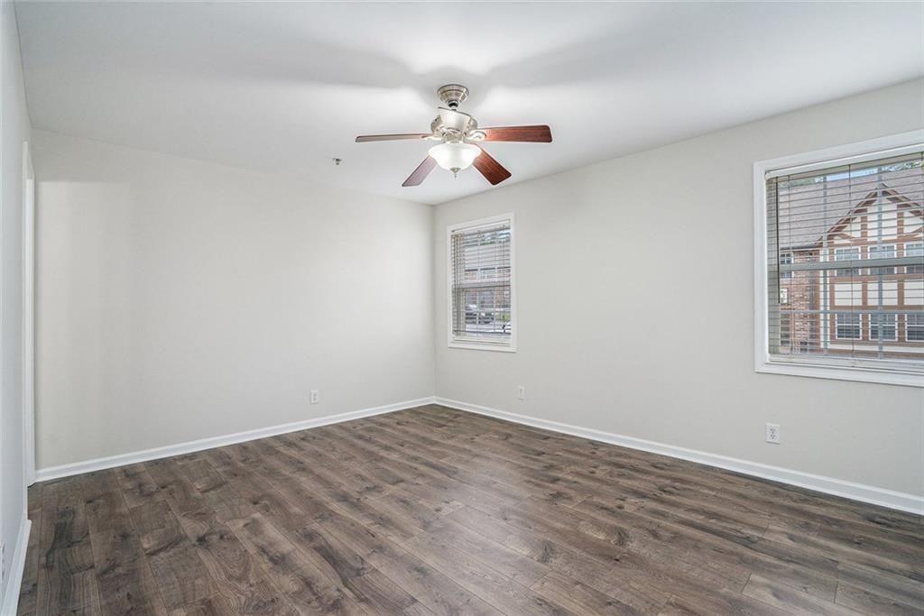 2825 Northeast Expressway, Unit F3 Atlanta, GA 30345 - Photo 23 of 45 wooden floor in an empty room with a window