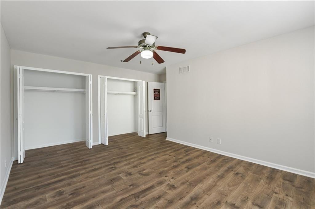 2825 Northeast Expressway, Unit F3 Atlanta, GA 30345 - Photo 30 of 45 a view of a room with wooden floor and ceiling fan