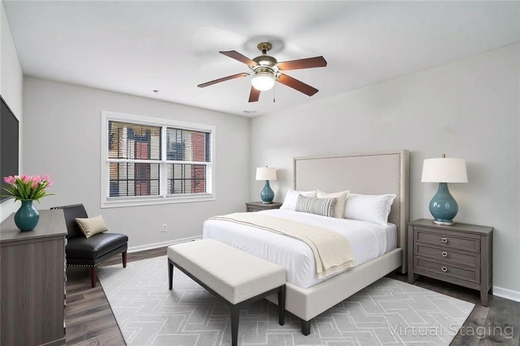 2825 Northeast Expressway, Unit F3 Atlanta, GA 30345 - Photo 34 of 45 a bedroom with a bed and wooden floor