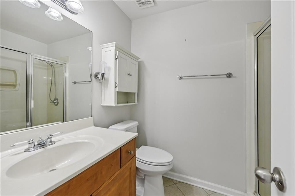 2825 Northeast Expressway, Unit F3 Atlanta, GA 30345 - Photo 35 of 45 a bathroom with a sink toilet and shower