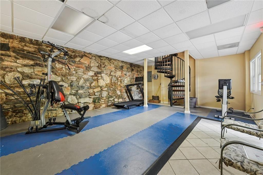 2825 Northeast Expressway, Unit F3 Atlanta, GA 30345 - Photo 41 of 45 a room with gym equipment and a large window
