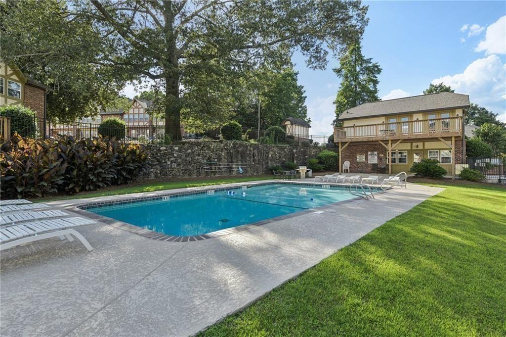 2825 Northeast Expressway, Unit F3 Atlanta, GA 30345 - Photo 42 of 45 a view of a patio with swimming pool