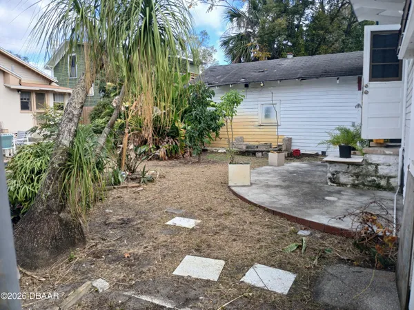 a backyard of a house with seating space