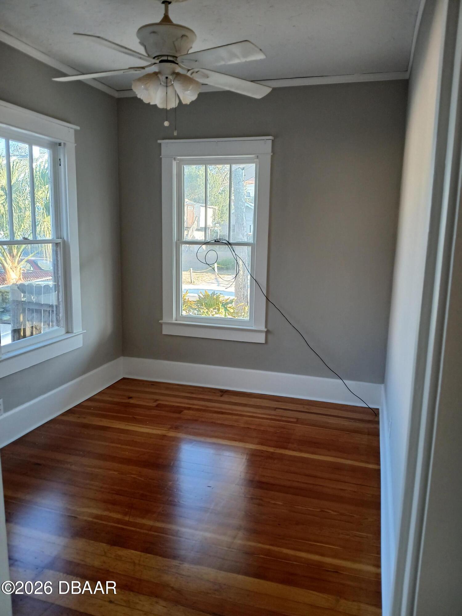 316 Michigan Avenue Daytona Beach, FL 32114 - Photo 8 of 9 a view of empty room with wooden floor and fan