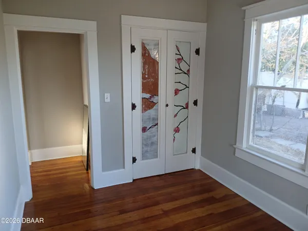 a view of entryway with wooden floor