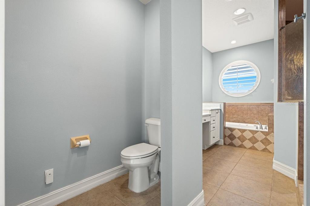 2 Mar Azul North Ponce Inlet, FL 32127 - Photo 59 of 98 a bathroom with a toilet a sink and a mirror
